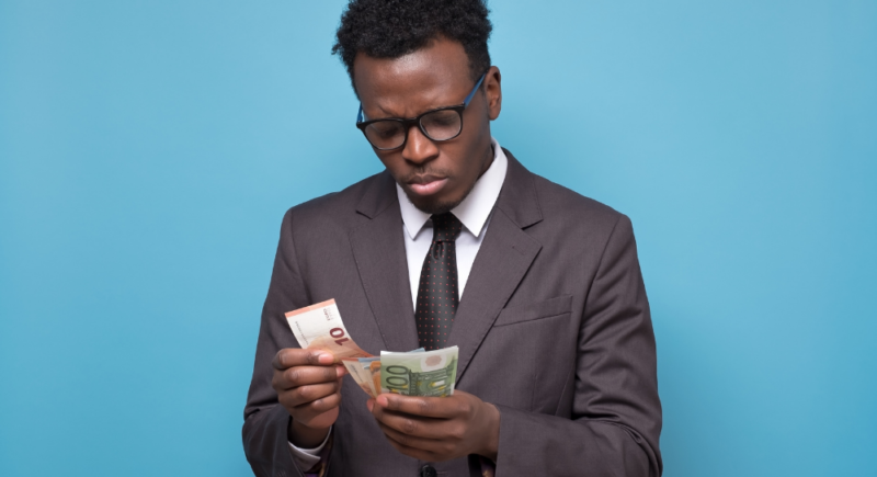 man counting money