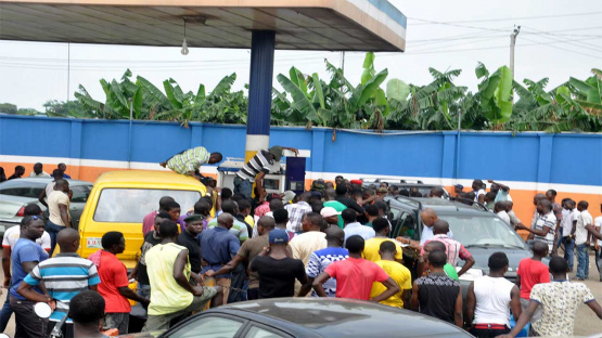 Nigerian consumers at a gas station after fuel subsidy removal