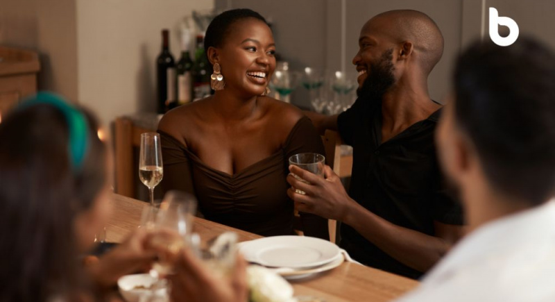 Can money buy happiness in Nigeria? A happy couple having an expensive dinner date, symbolizing the complex relationship between wealth and happiness.