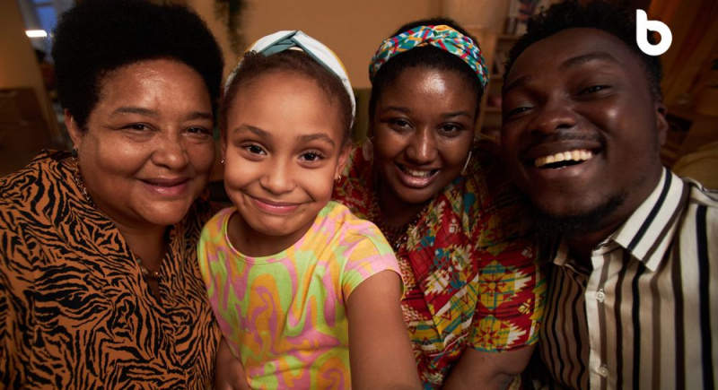 A photo of an African family gathered together, highlighting unity and support but still bordering on the question "Is black tax a good thing?"